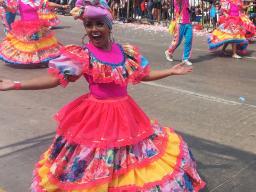 Colombian woman dances past in Carnival in Barranquilla, Bogota