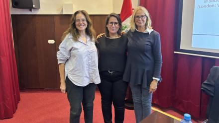 Three women smiling for the camera