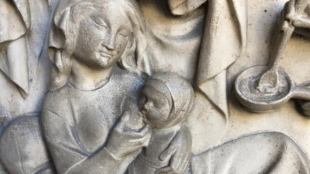 sculpture of mother breastfeeding baby 