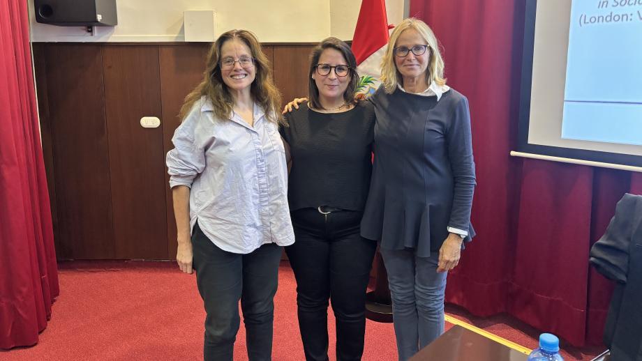Three women smiling for the camera