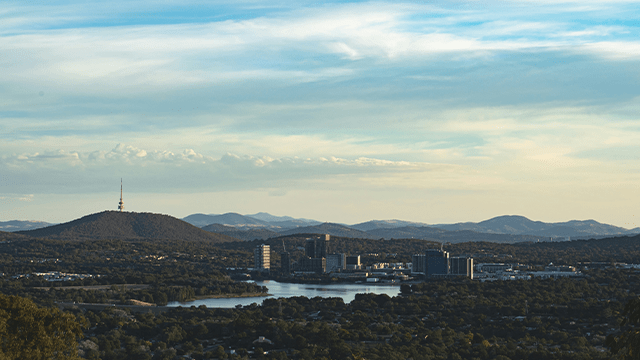 Canberra city skyline under blue sky during daytime